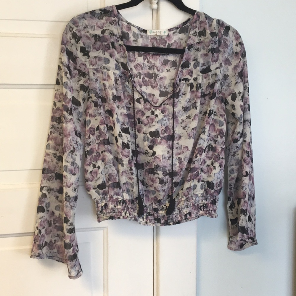 Slightly sheer floral top with tassels